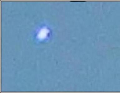UFOs patrol the sky of the earth. A black dot hangs in the sky.